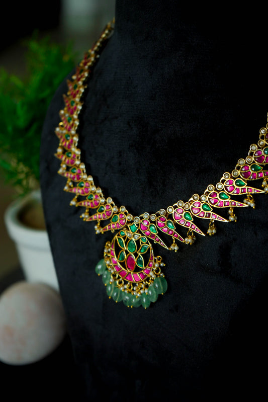Jadau Kundan Necklace set with Peacock style earrings.