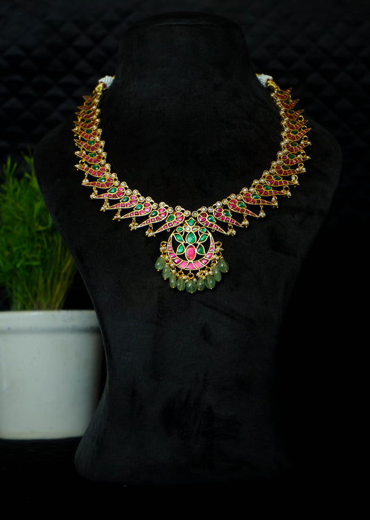 Jadau Kundan Necklace set with Peacock style earrings.